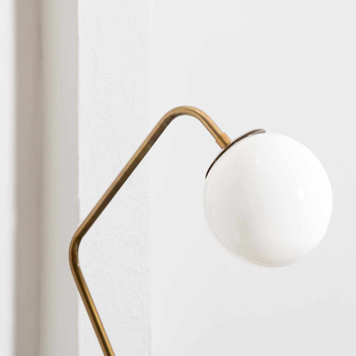 a lamp with a white globe