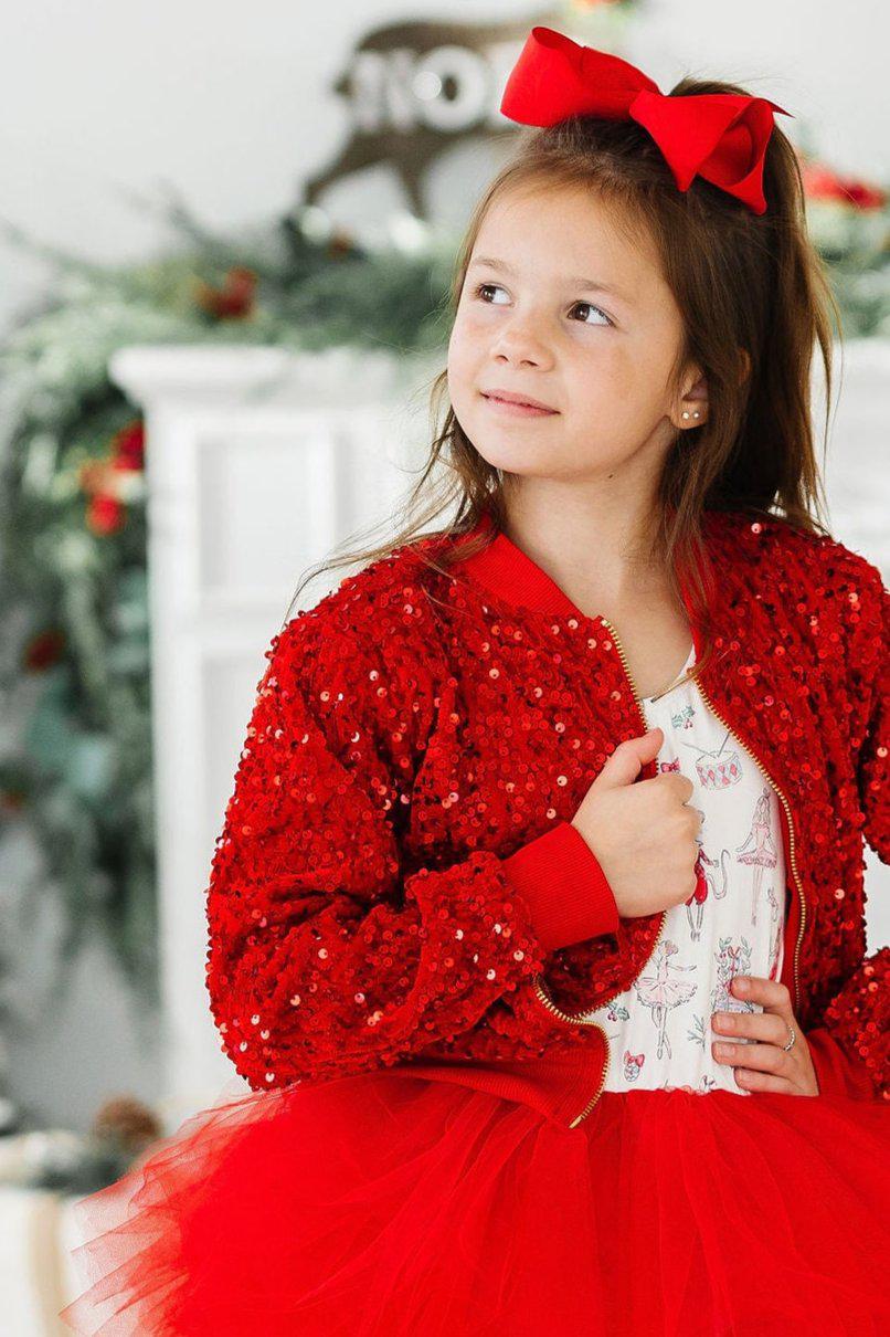 a girl in a red jacket