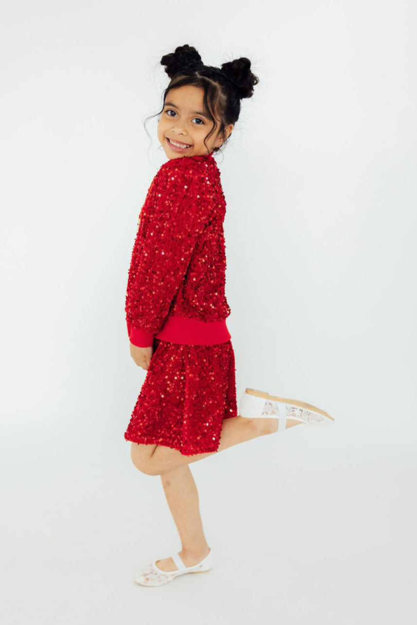 a girl in a red dress