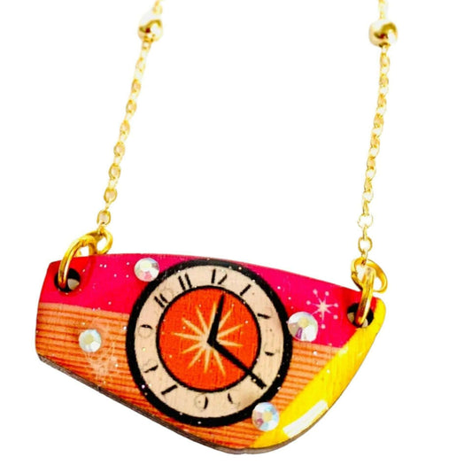 a necklace with a clock on it