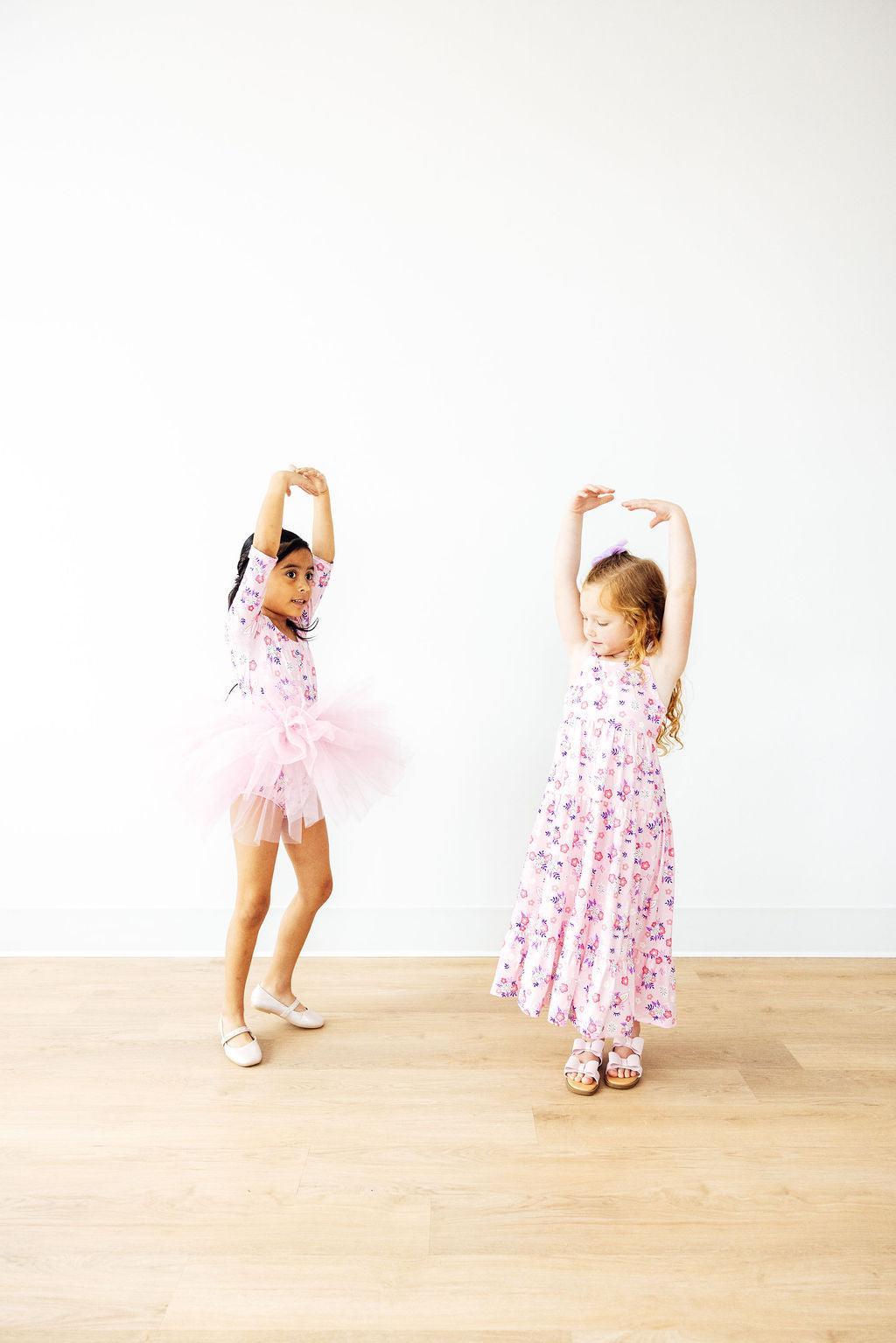 two girls in pink dresses