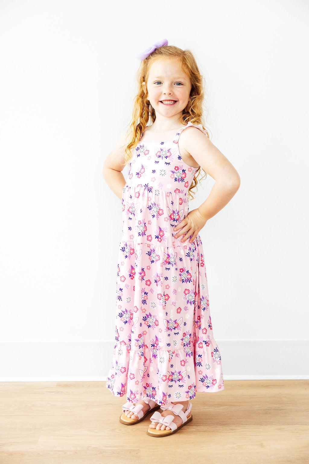 a girl in a pink dress