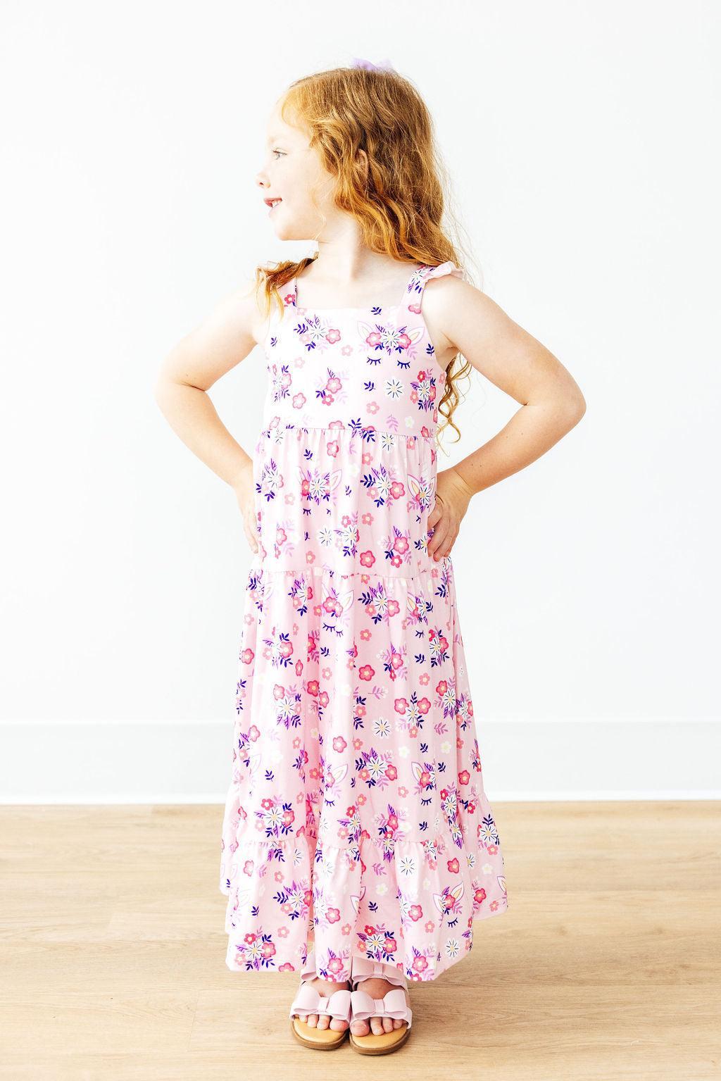 a girl in a pink dress