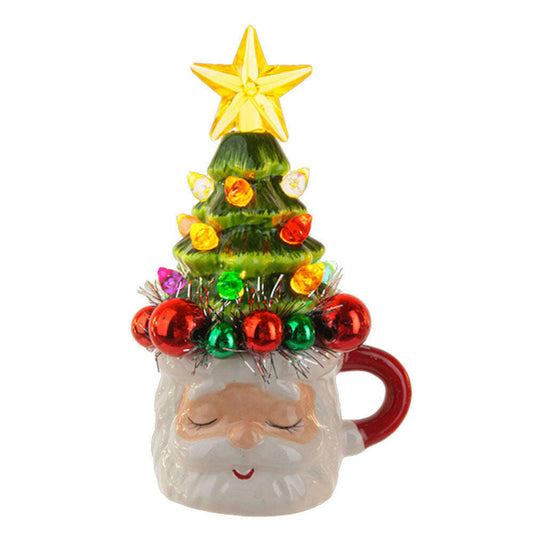a mug with a christmas tree on it