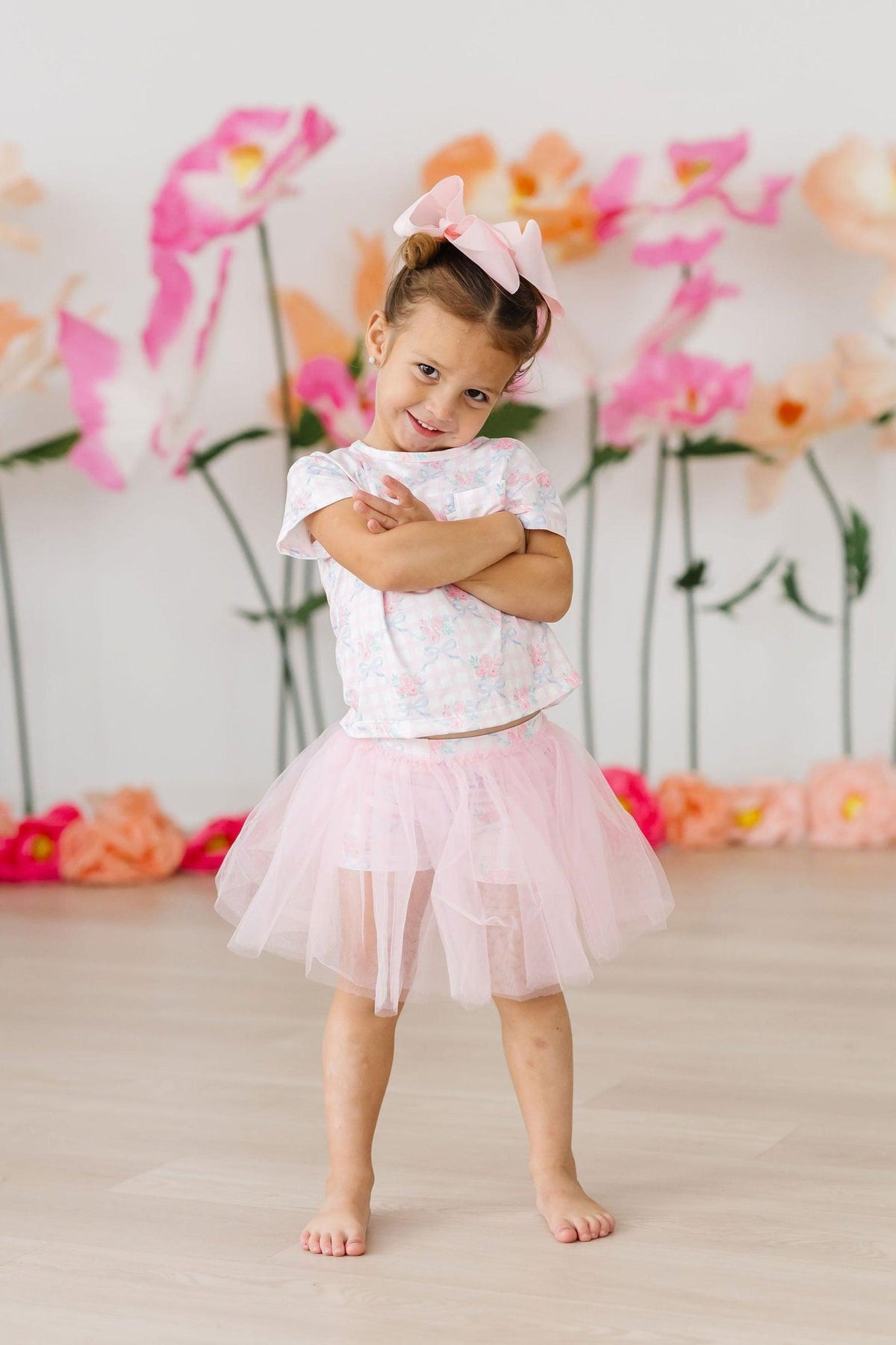 a girl in a tutu and a bow