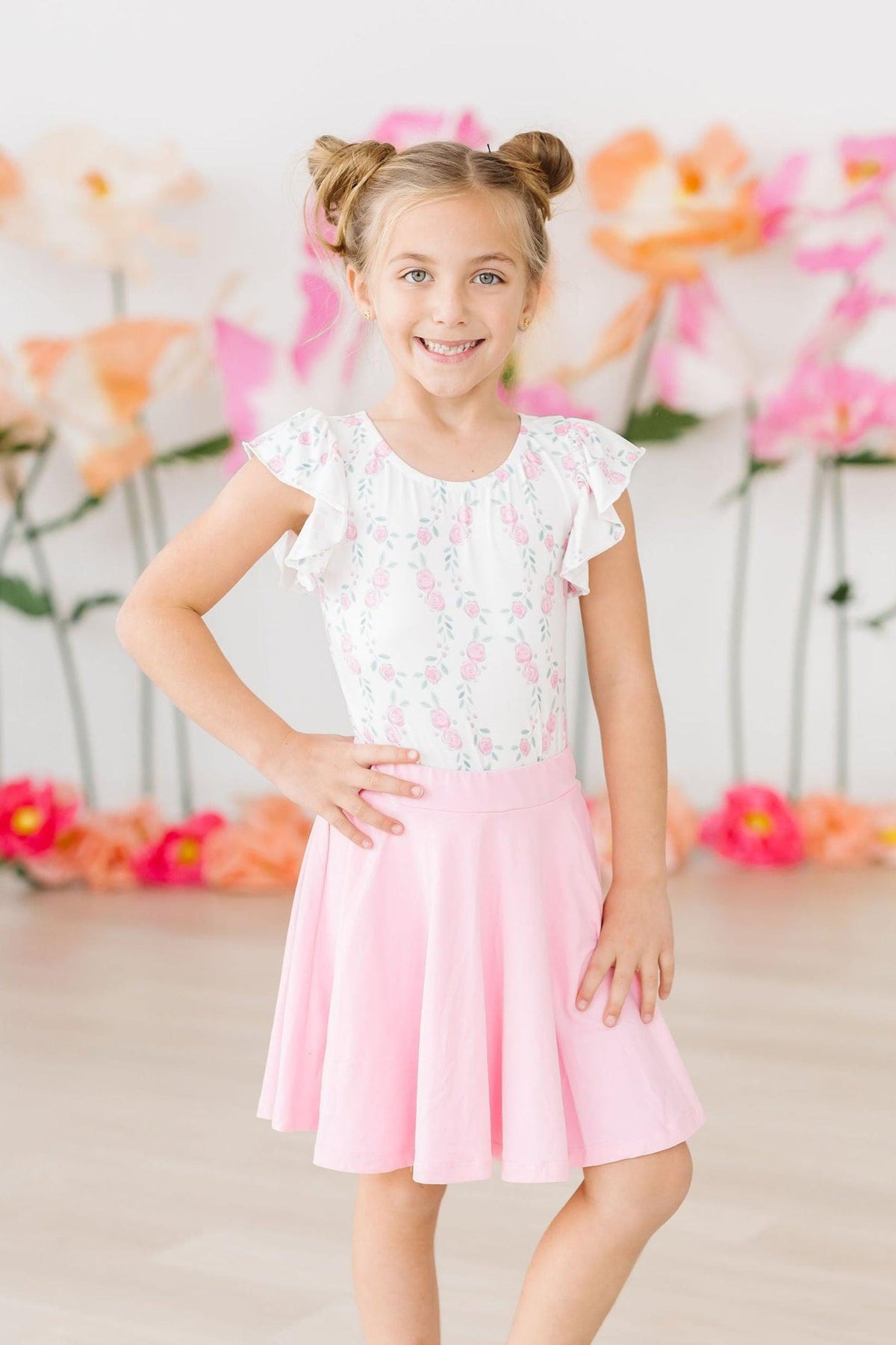 a girl in a pink skirt
