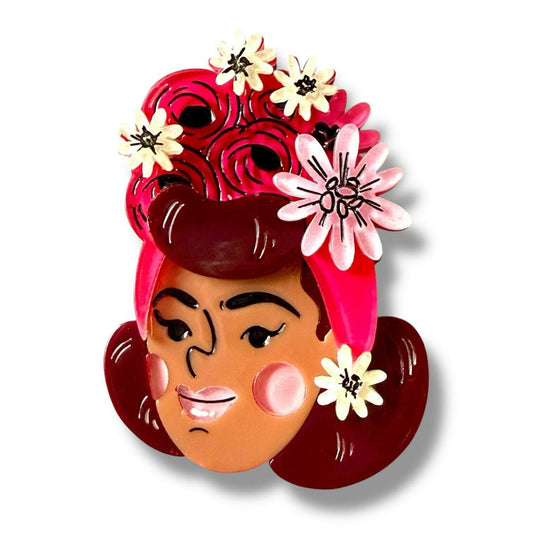 a brooch with flowers on it