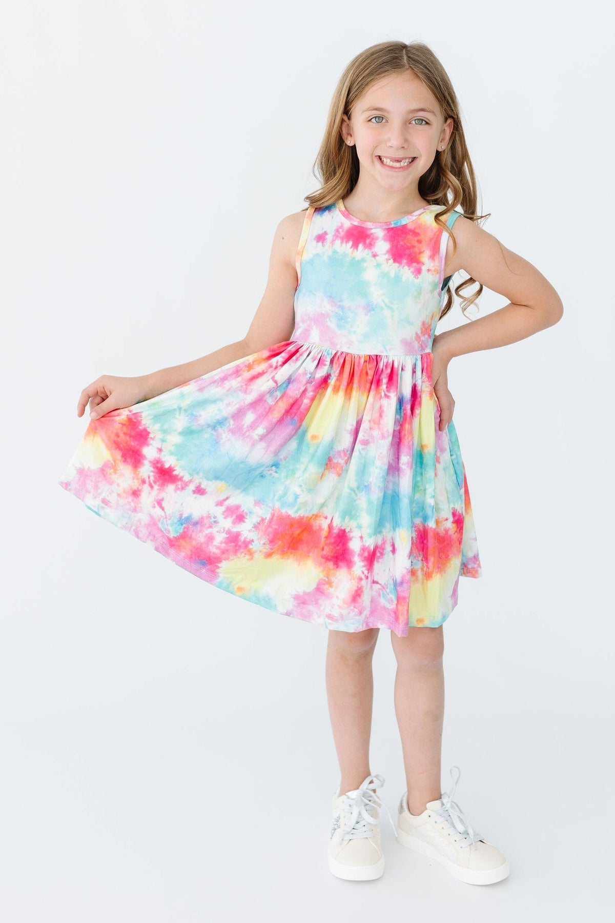 a girl in a tie dye dress