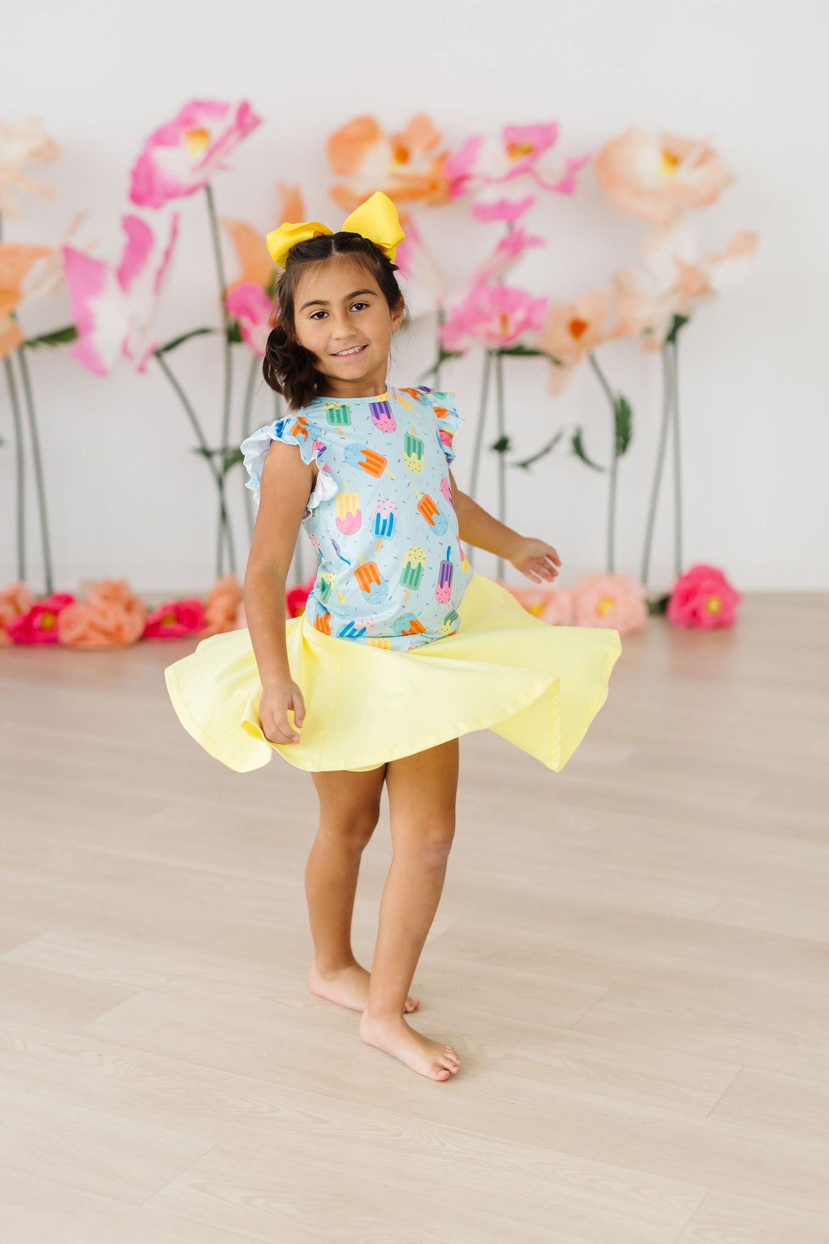 a girl in a yellow dress
