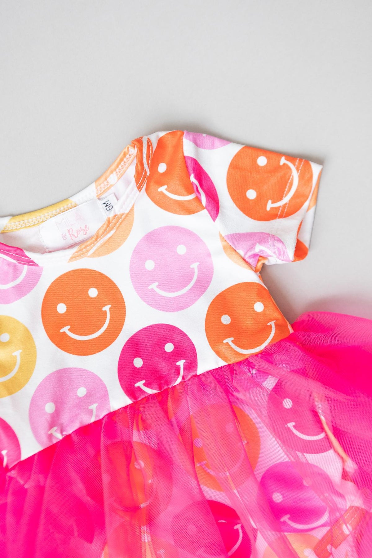 a dress with smiley faces on it