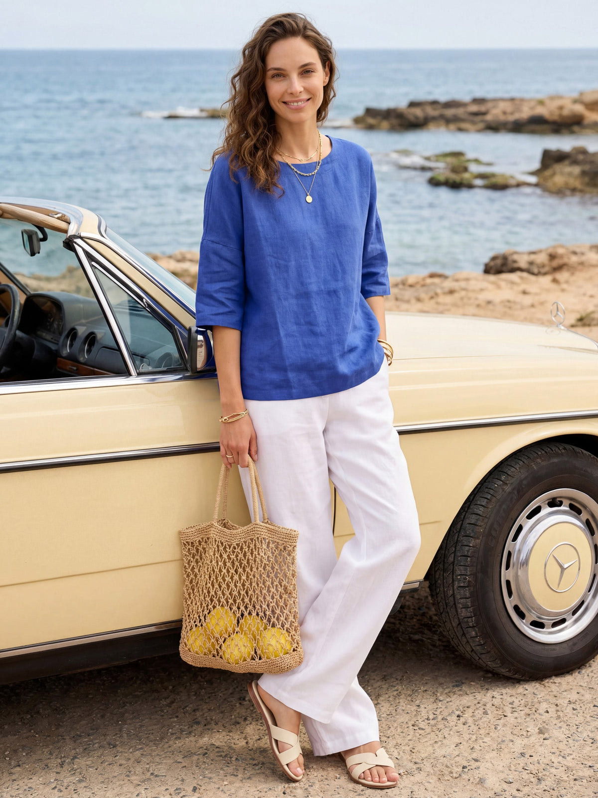 a woman standing next to a car