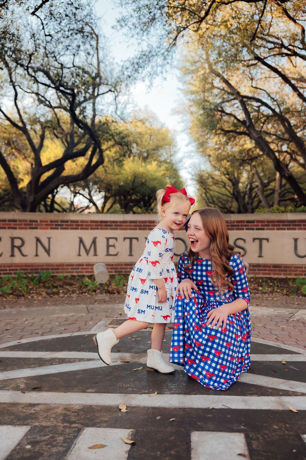 a woman and a girl posing for a picture