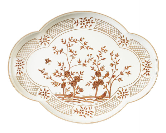 a white and brown plate with a bird on it