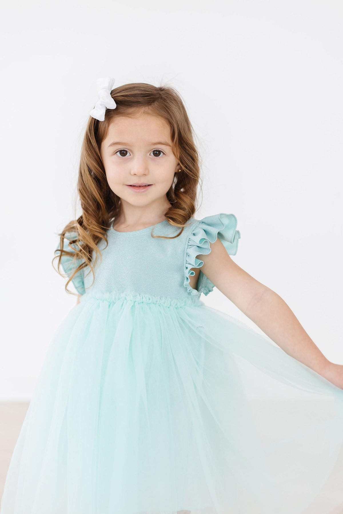a girl in a blue dress