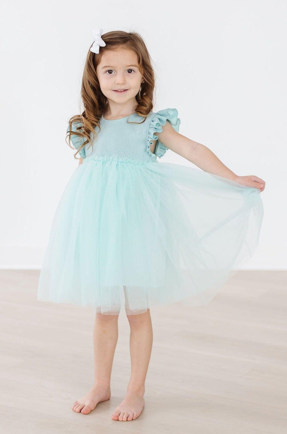 a girl in a blue dress