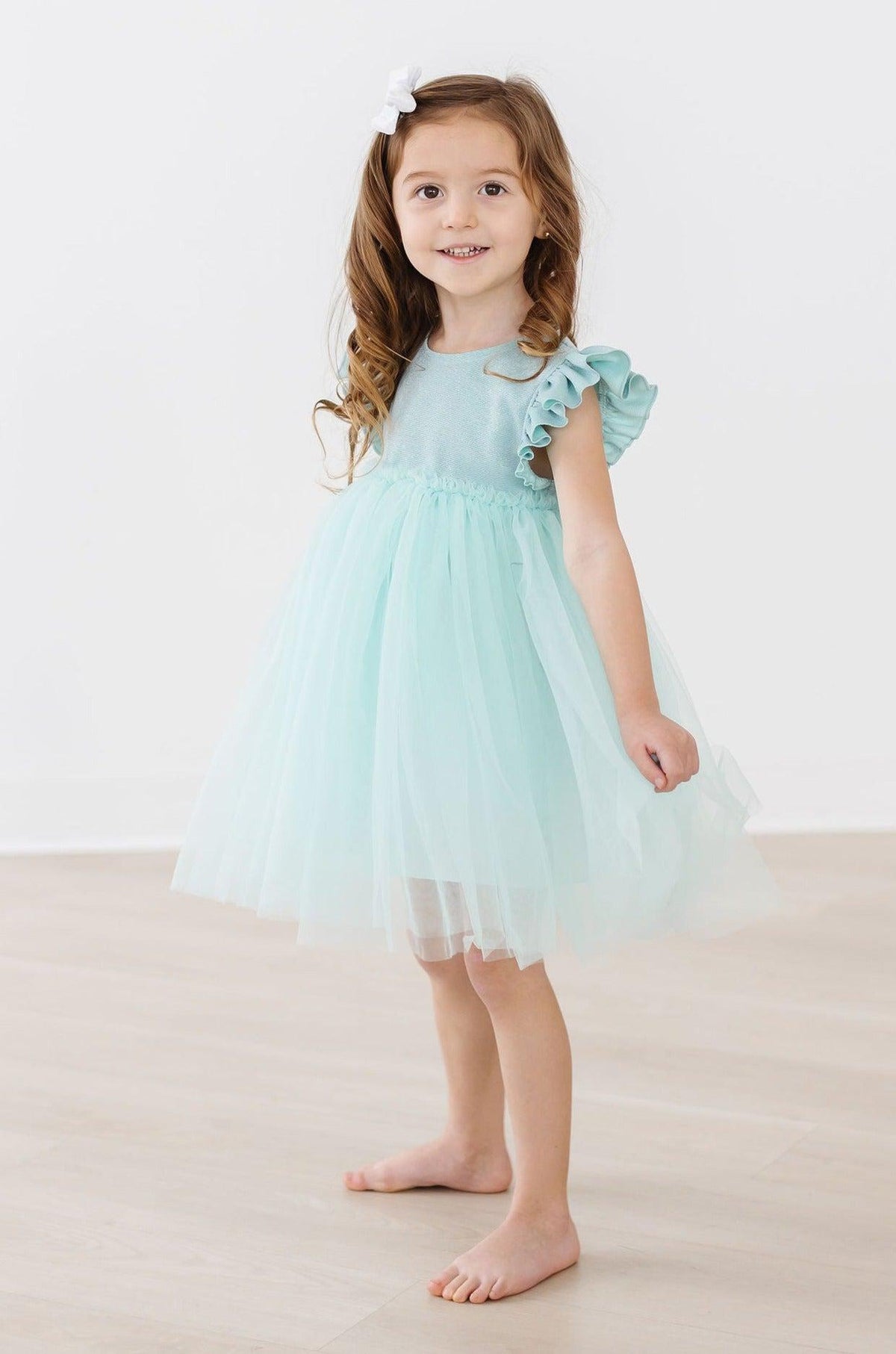 a girl in a blue dress