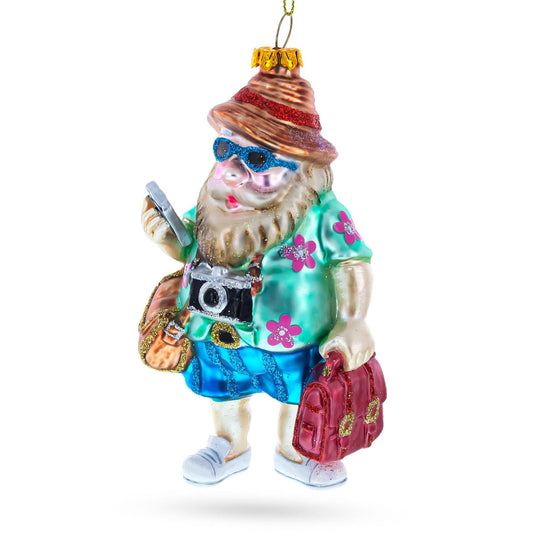 a christmas ornament with a gnome holding a camera and luggage