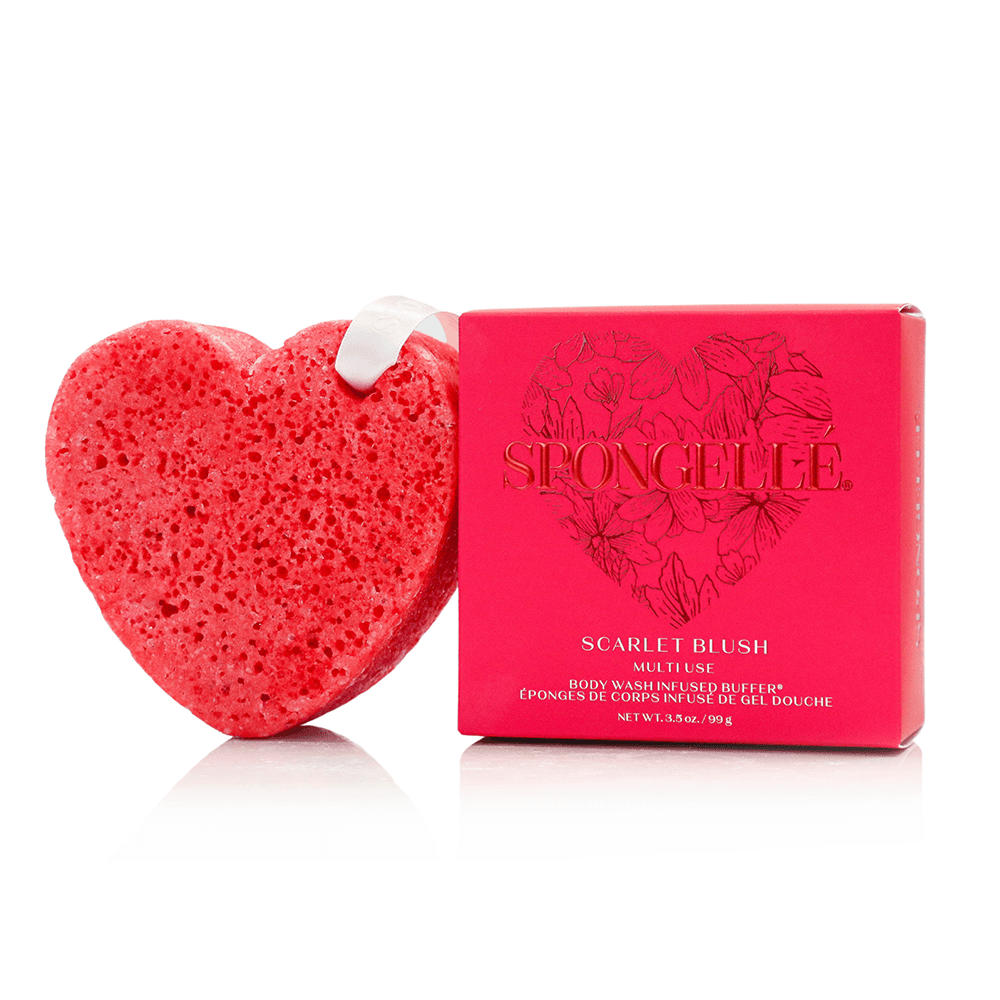 a red heart shaped object next to a box