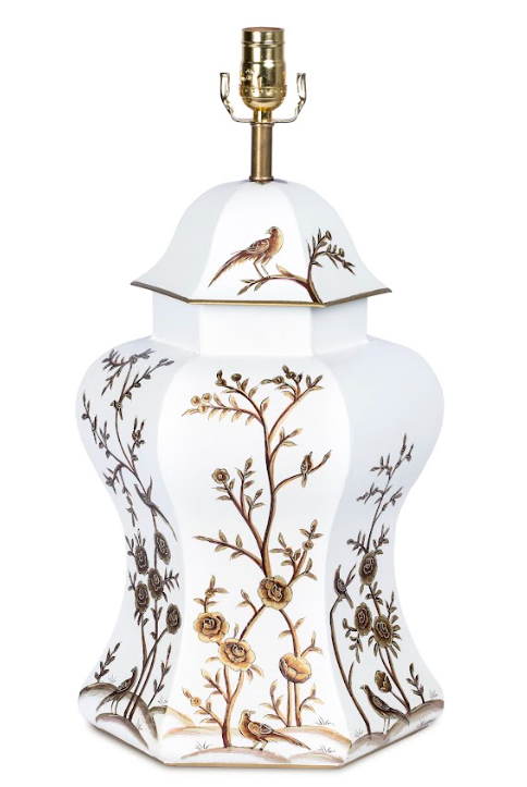 a white and gold vase with a bird painting on it