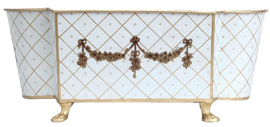 a white and gold box with brown floral design