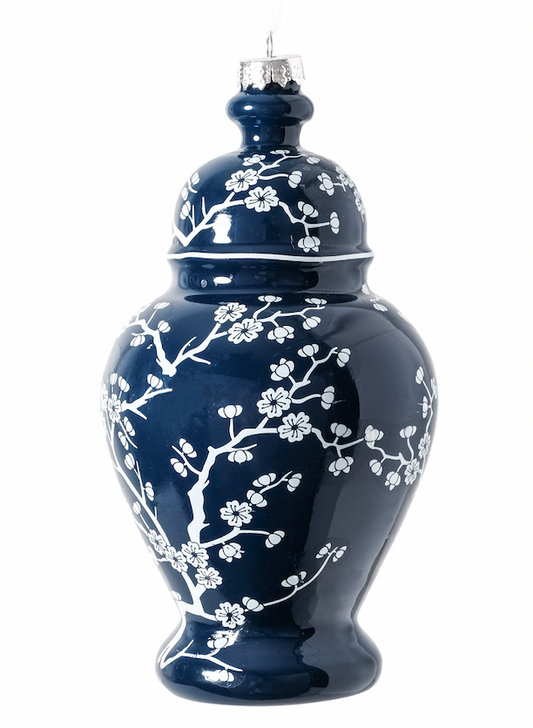 a blue and white vase with a lid