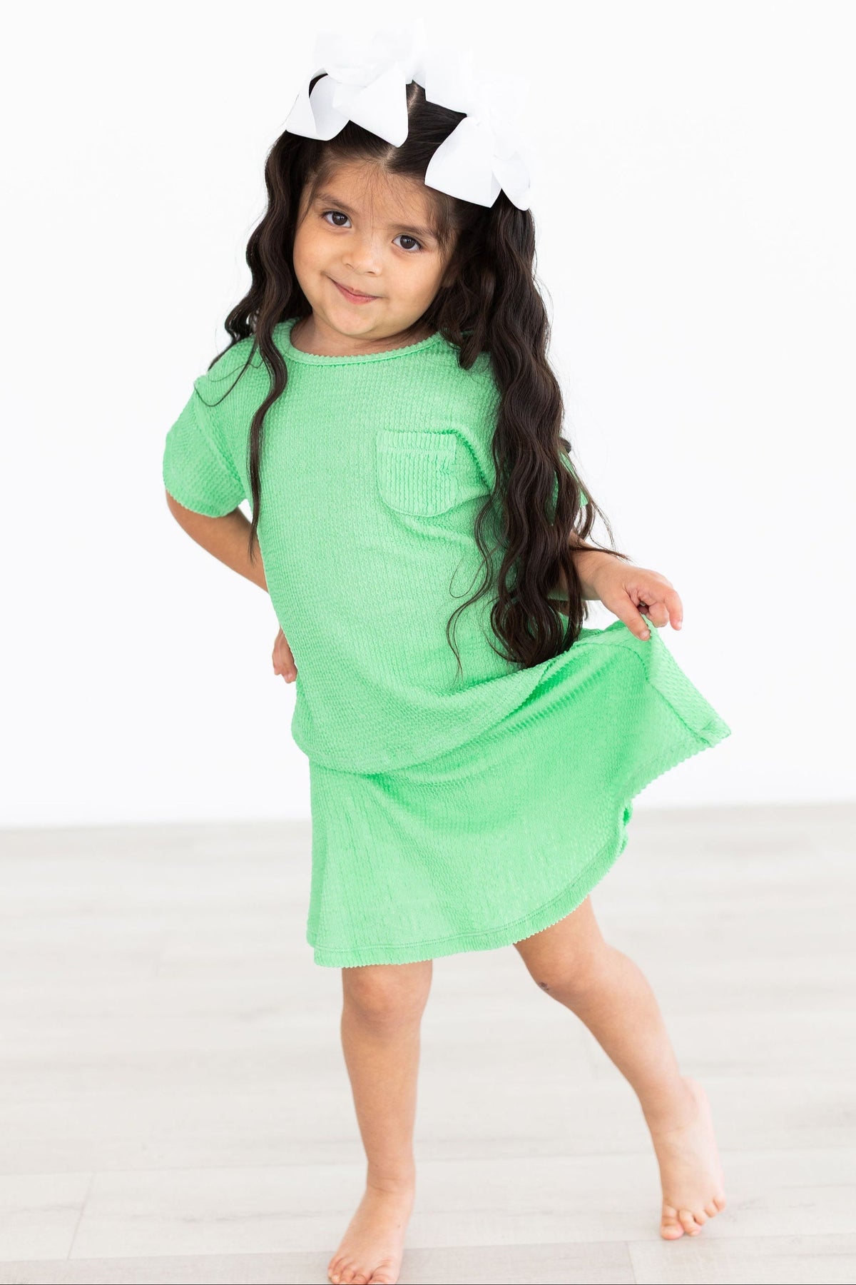 a girl in a green dress