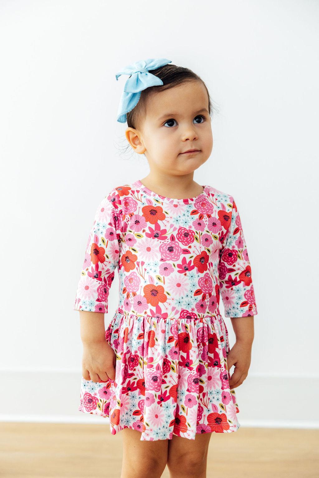 a girl with a bow on her head