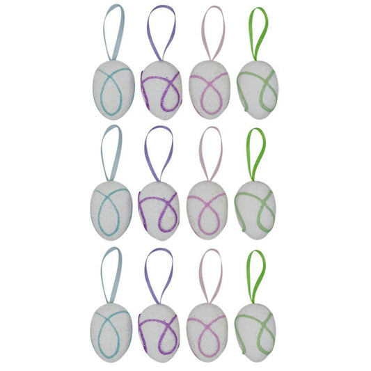 a group of white eggs with purple and green designs