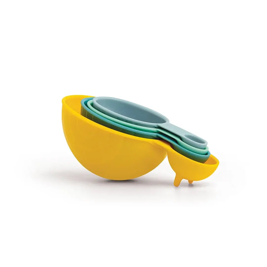 a yellow measuring cup with blue measuring cups in it