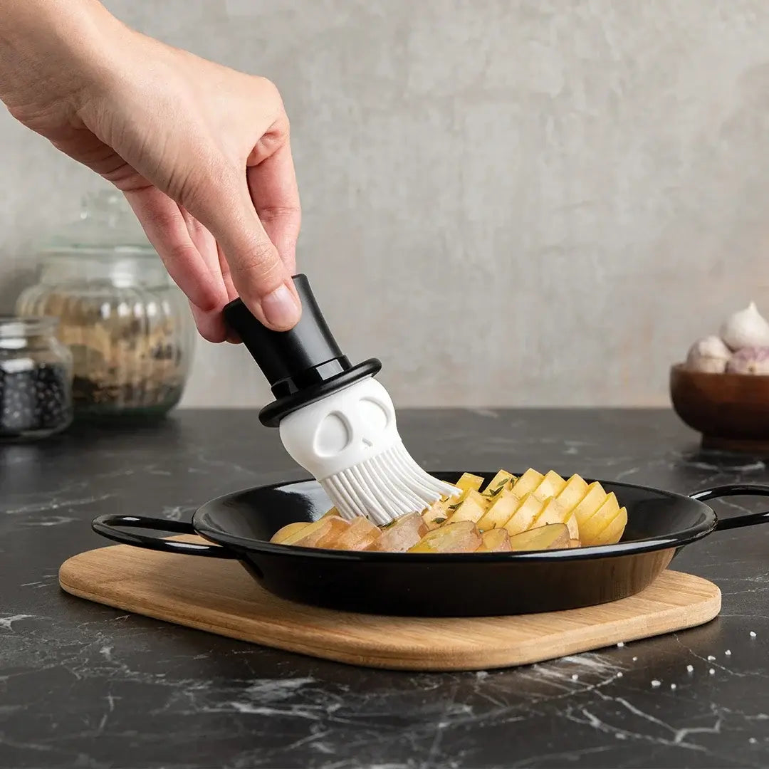 a person cooking food in a pan