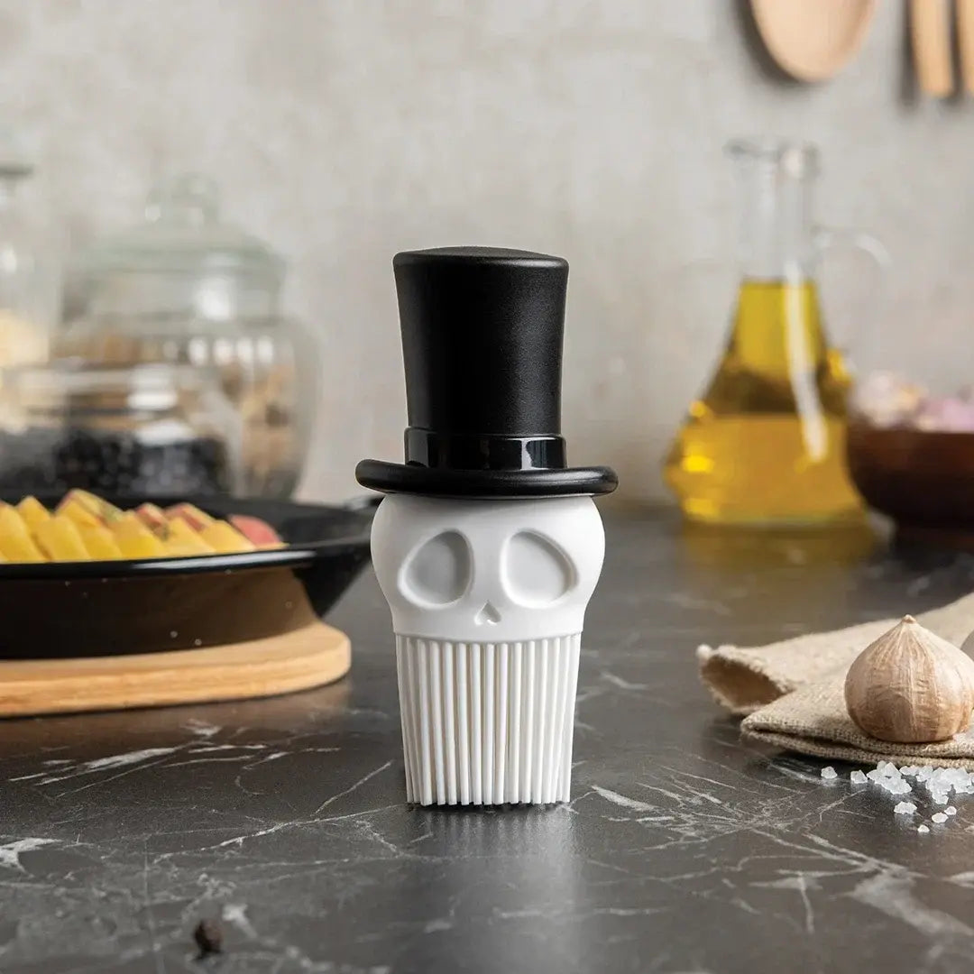 a white object with a black top hat on a table