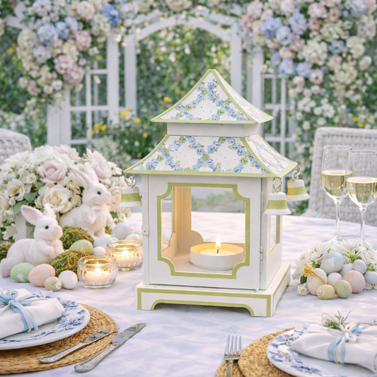 a table with a candle holder and bunny decorations