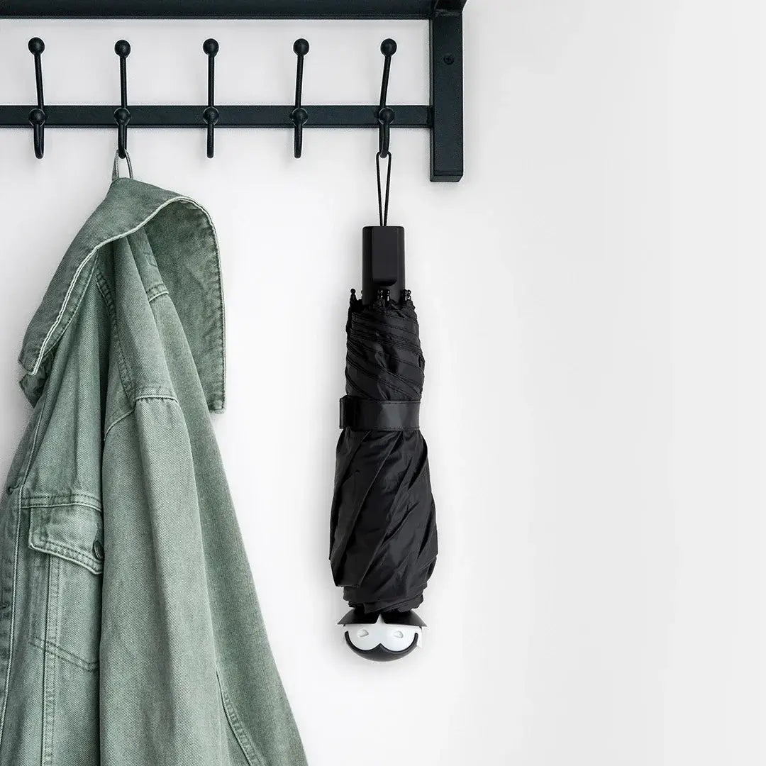 a coat rack with an umbrella on it