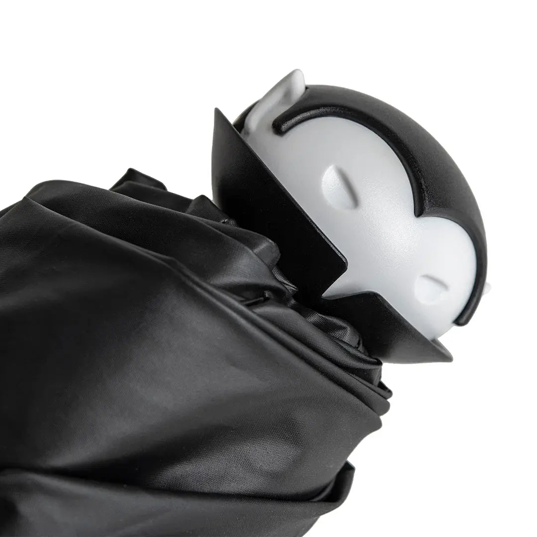 a toy in a black robe