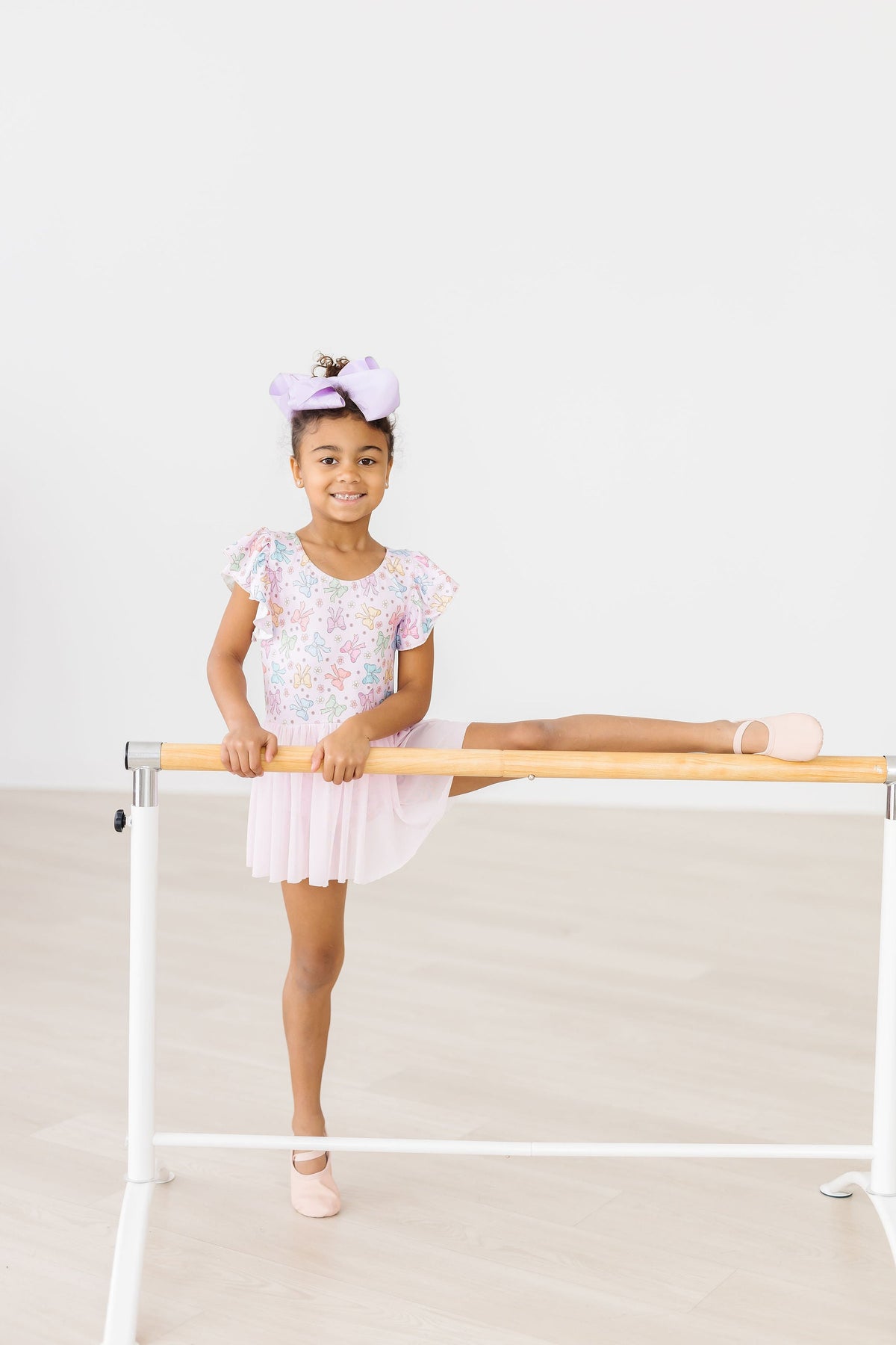 a girl in a tutu and ballet shoes