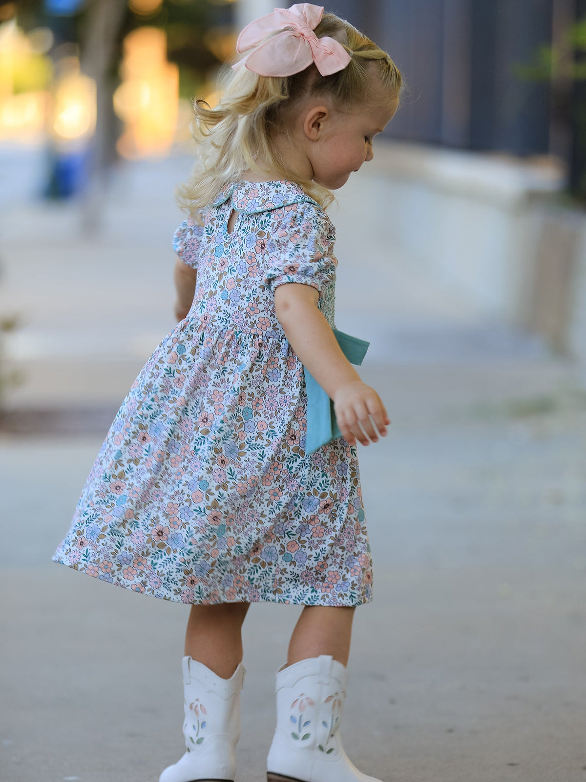 a girl in a dress and boots