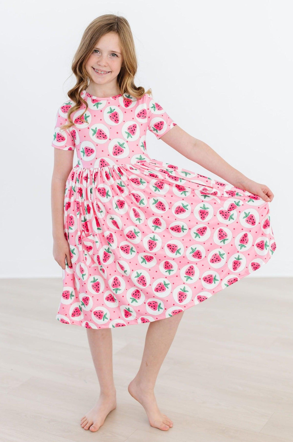 a girl in a pink dress