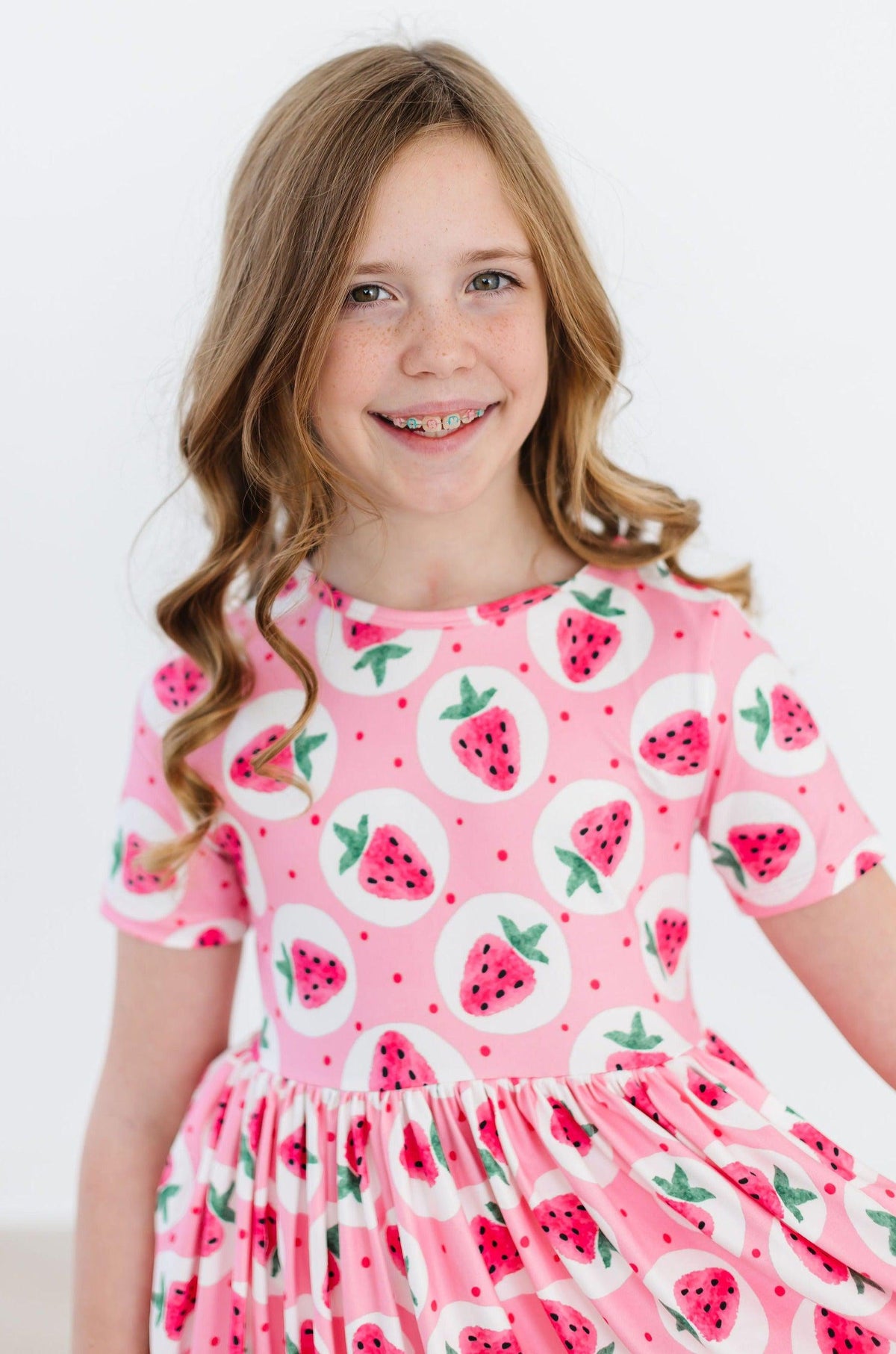 a girl smiling at the camera