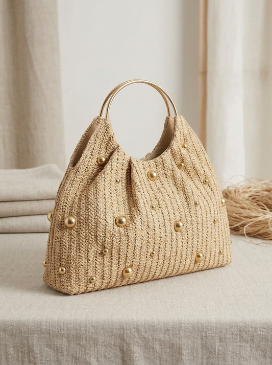 Artisanal Studded Handwoven Raffia Bag with Sculptural Gold Ring Handle