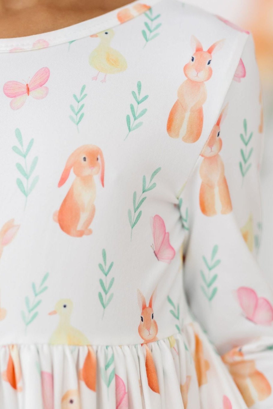 a person wearing a white shirt with cartoon animals on it
