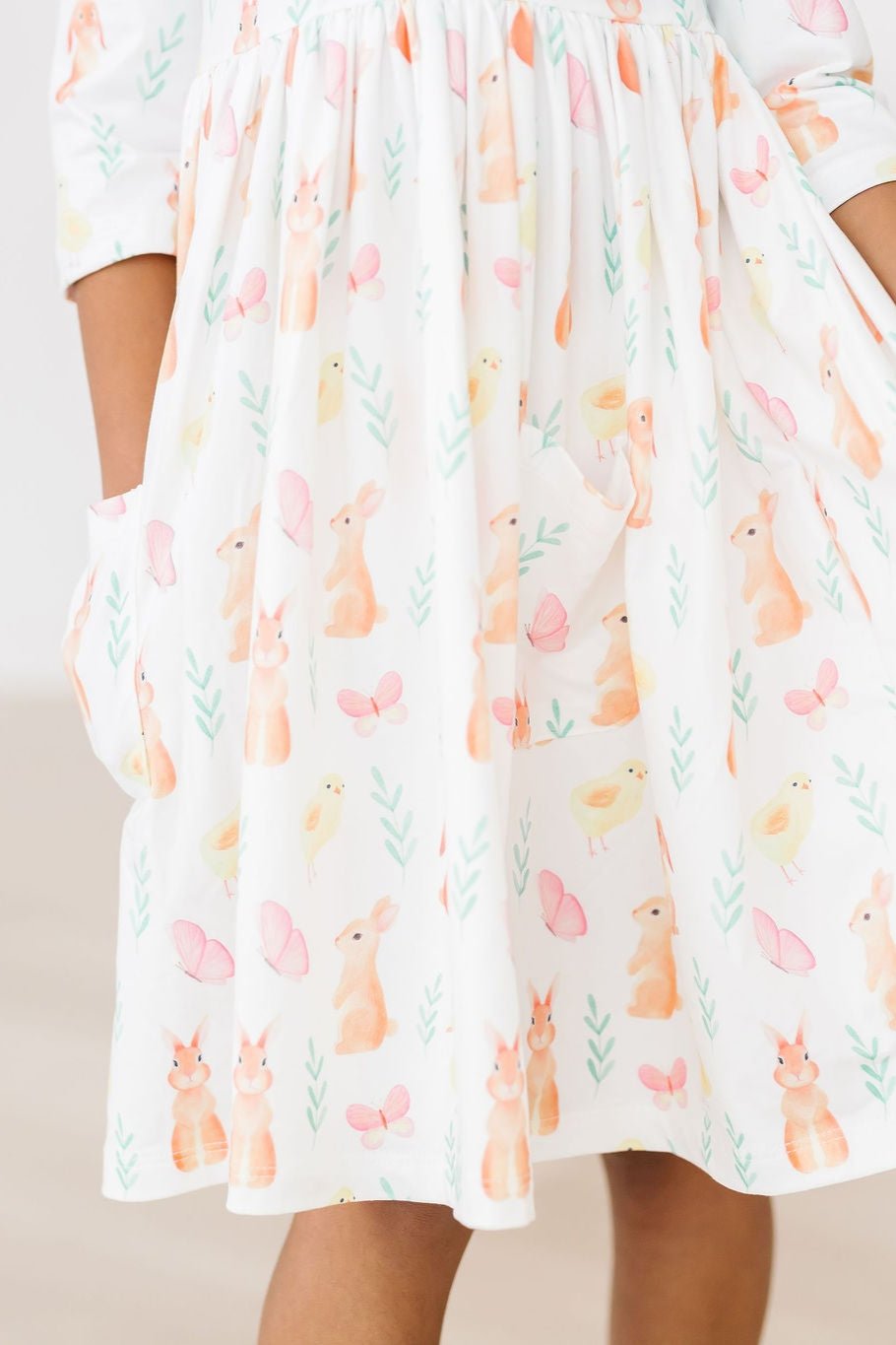 a person wearing a dress with a pattern on it