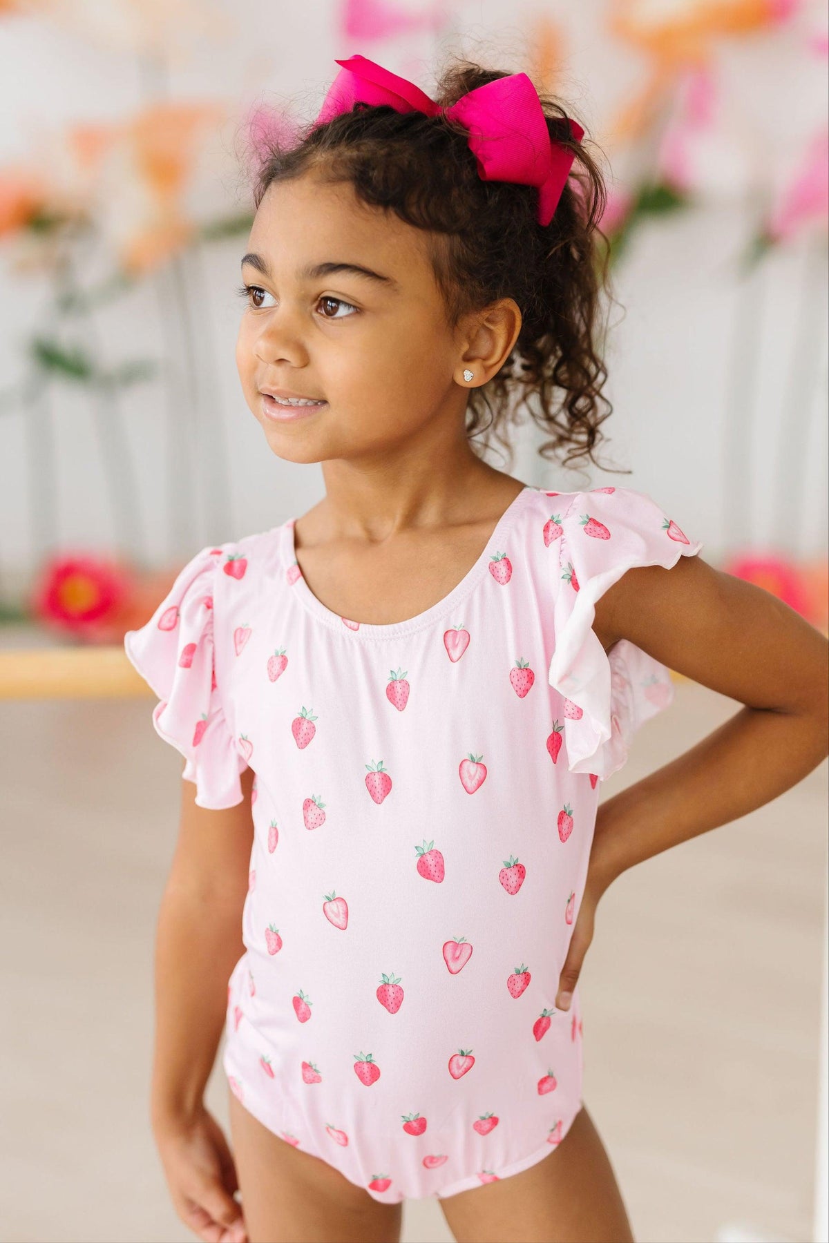 a girl in a pink dress