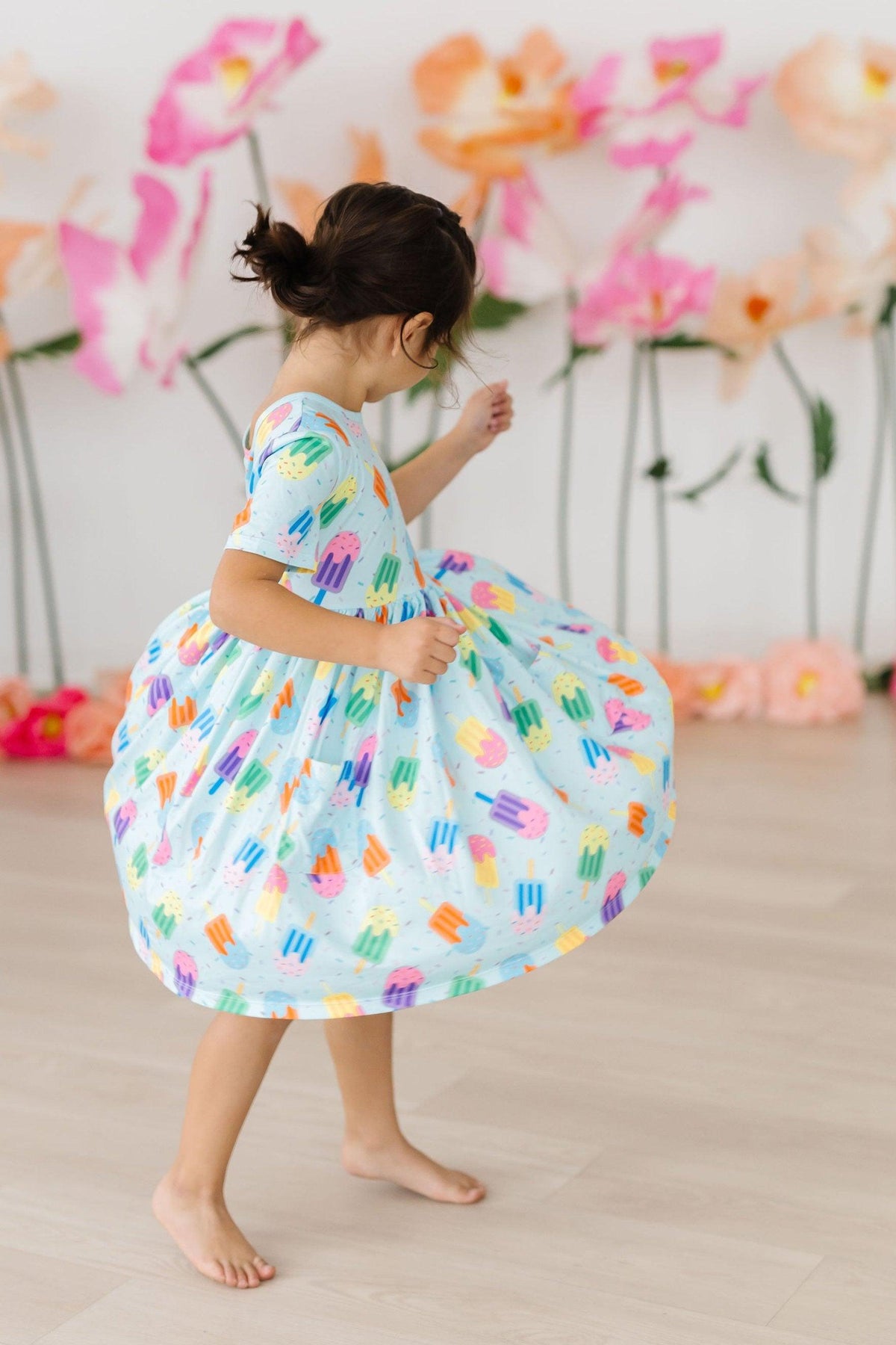 a girl dancing in a dress