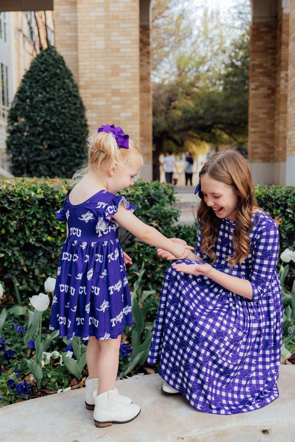 two girls in blue dresses