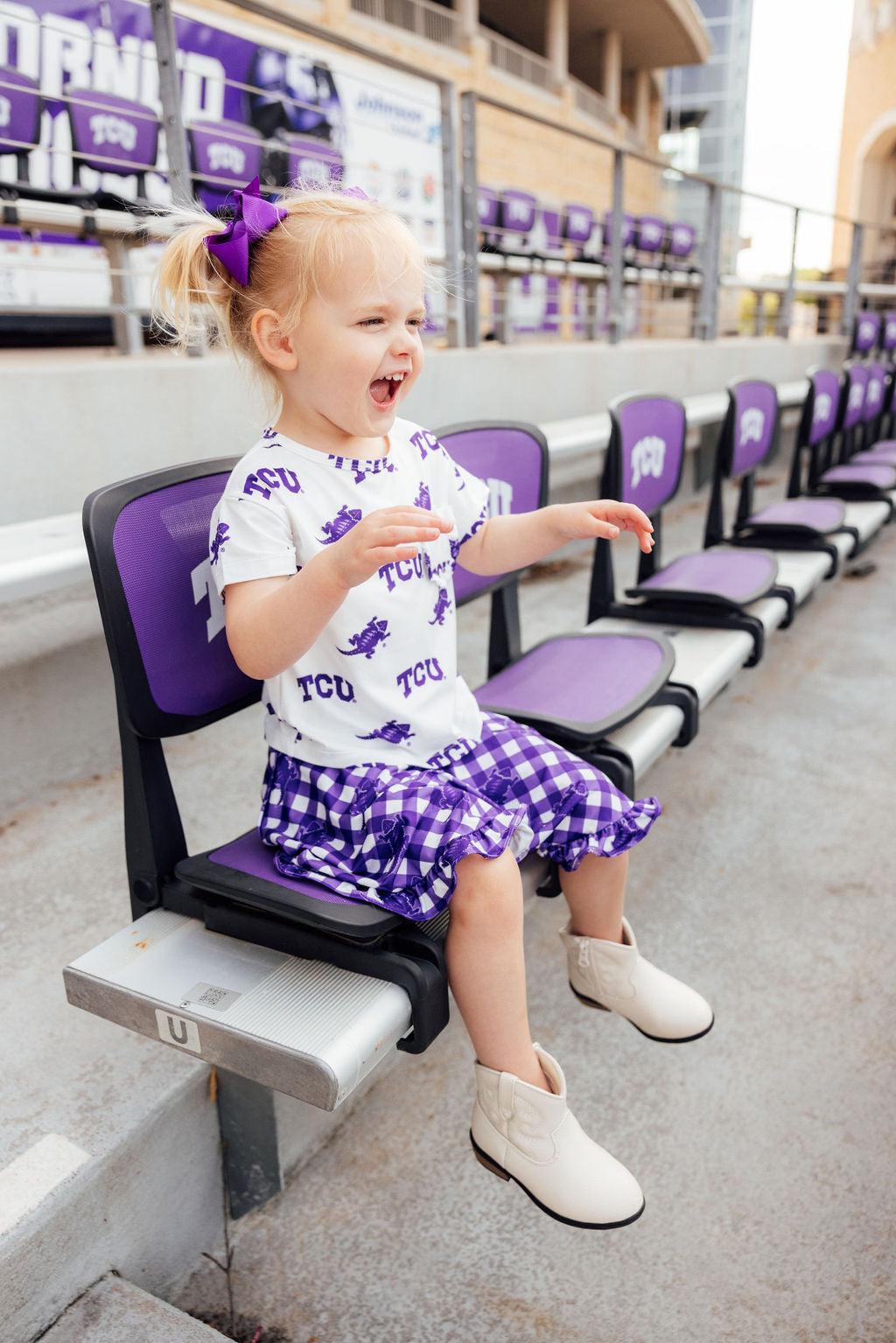 a girl sitting on a chair