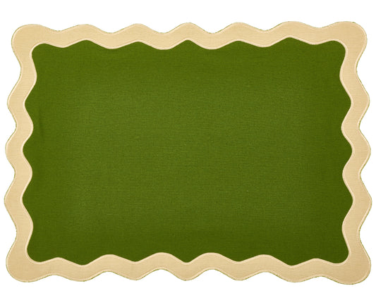 a green and white rug with a scalloped edge