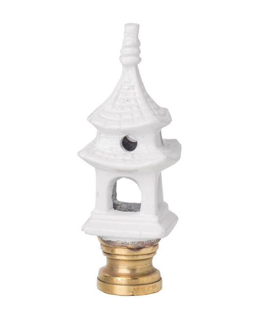 a white and gold lamp finial