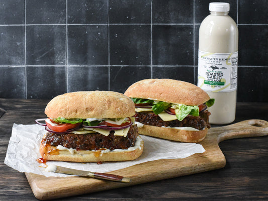 two sandwiches on a cutting board