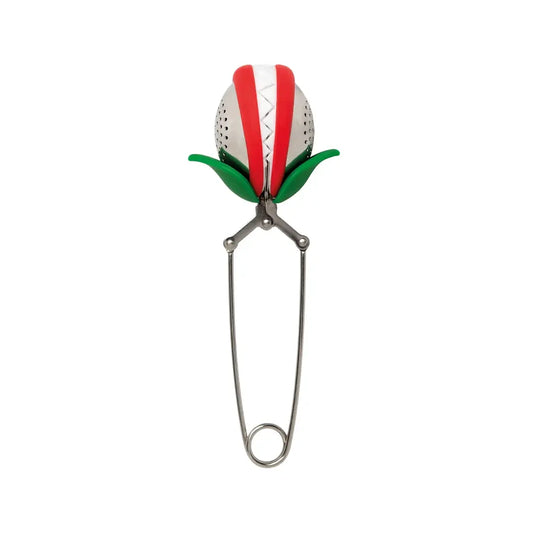 a metal object with a leaf on it