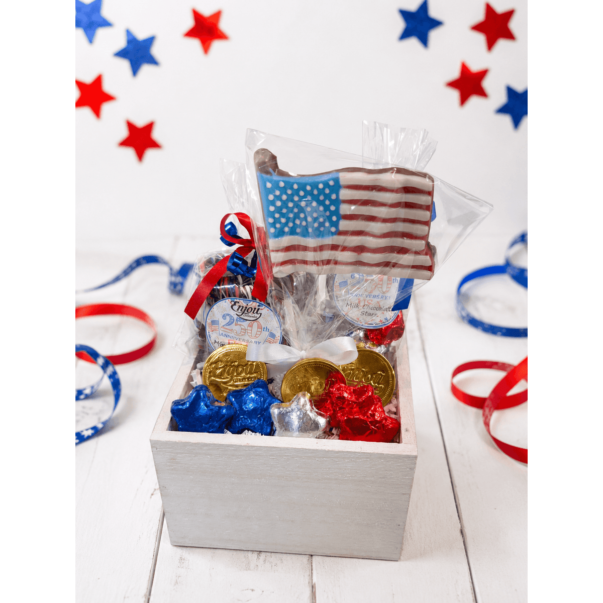 a box of candy and ribbons